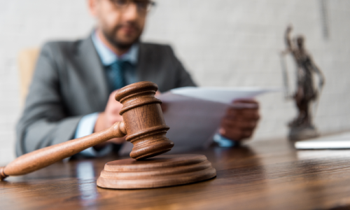 An Albany personal injury lawyer reading papers relating to a client's claim.