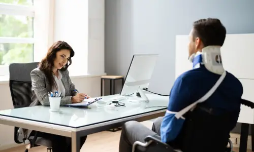 A rideshare accident victim consulting an Albany rideshare accident lawyer regarding his personal injury claims.